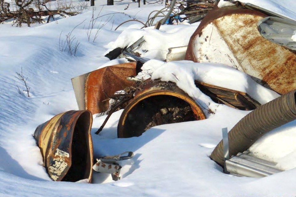 Material identified by a GNWT inspector as "fire-impacted" is seen in an image from a February 2024 inspection report.